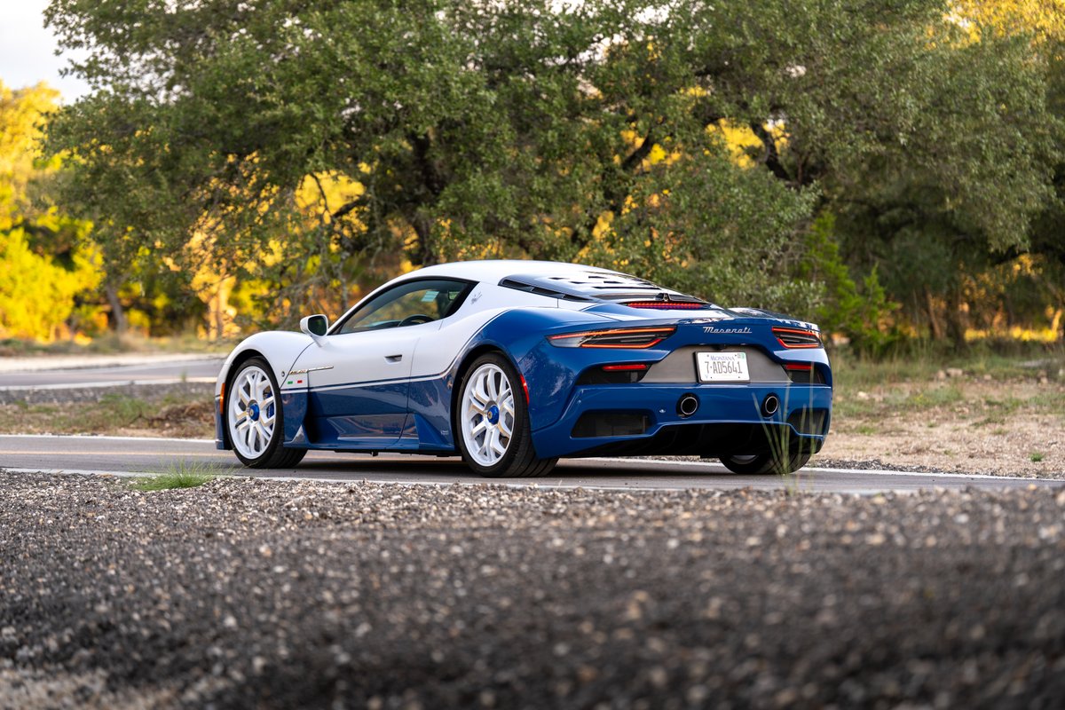 2024 Maserati MC20 Icona in white and blue livery with white rims.