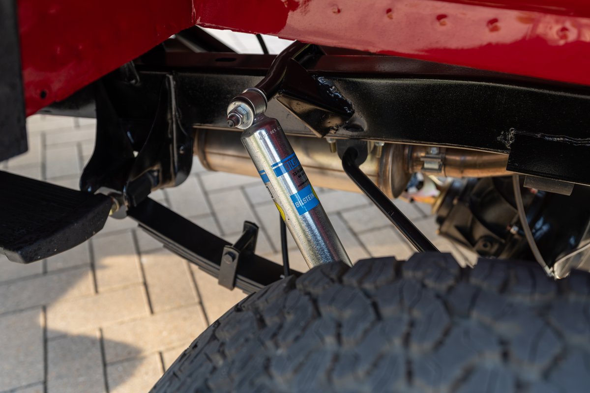 1966 Ford Bronco rear leaf spring suspension with a Bilstein shock absorber.
