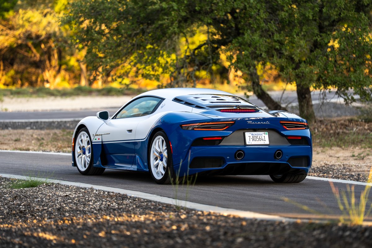 2024 Maserati MC20 Icona in blue and white livery with white rims.