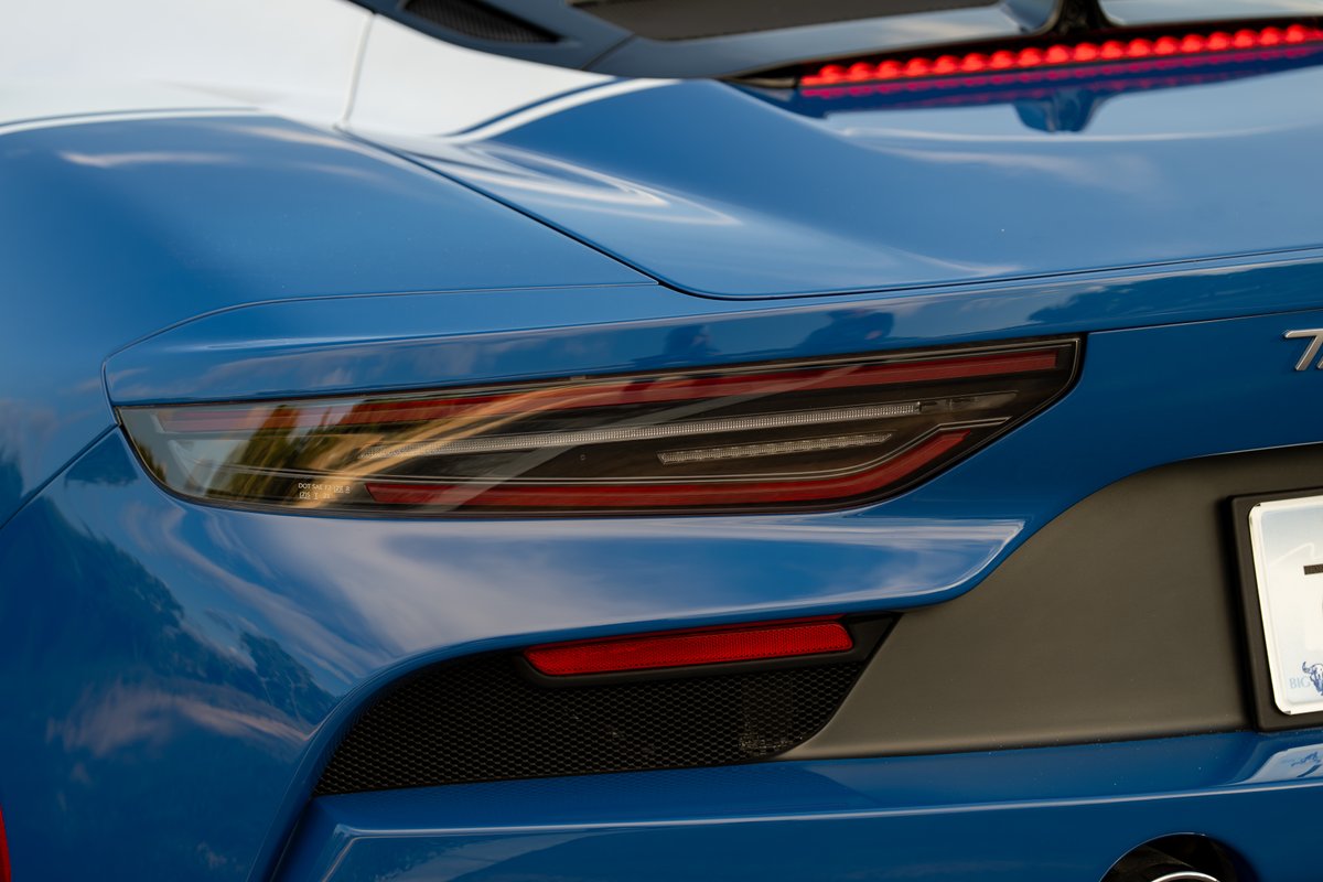 Close-up of the rear tail light on a blue 2024 Maserati MC20 Icona.