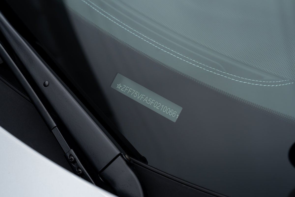 2015 Ferrari 458 Speciale VIN plate on windshield.