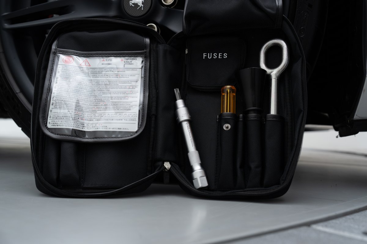 2015 Ferrari 458 Speciale tire change kit with tow hook and fuse puller.