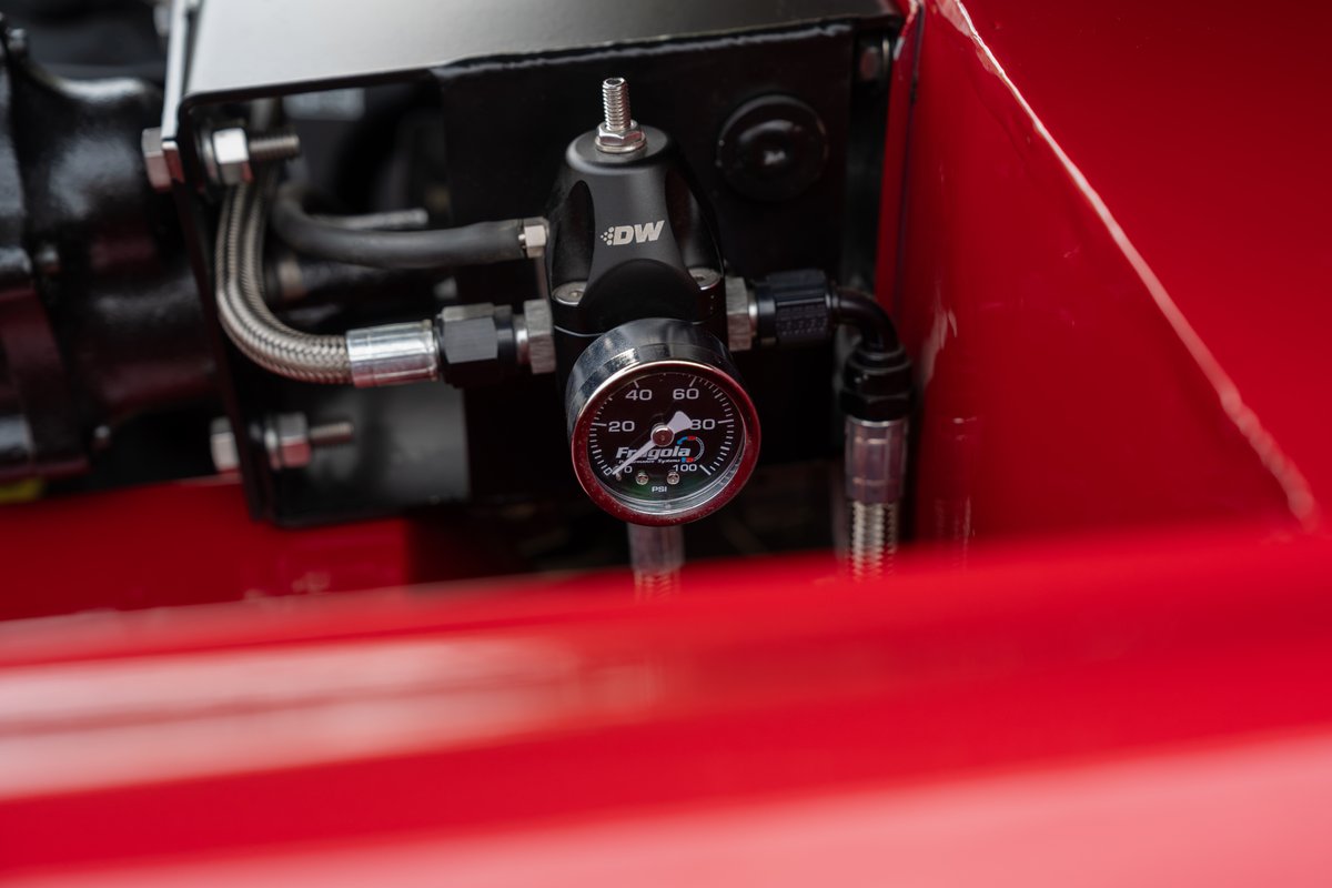 1966 Ford Bronco engine bay with DW fuel pressure regulator and Fragola gauge.