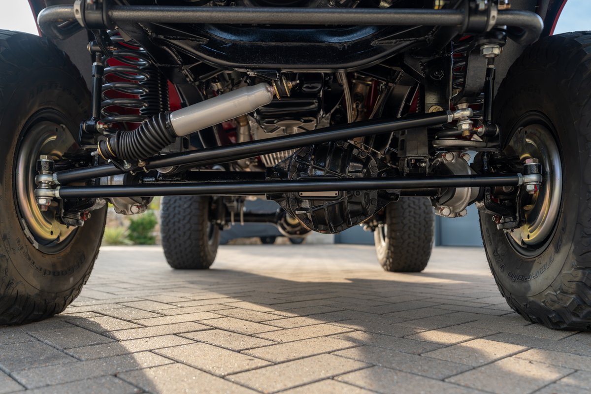 1966 Ford Bronco chassis with heavy-duty suspension and off-road tires.