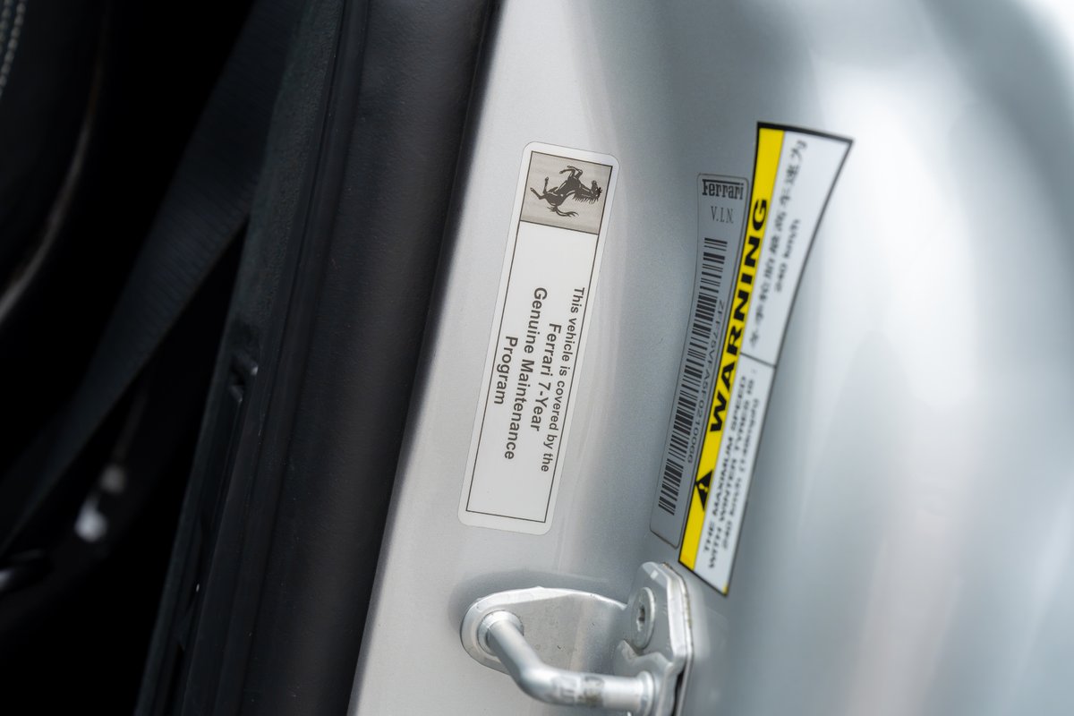 Ferrari 458 Speciale door sticker. VIN and maintenance program info visible.