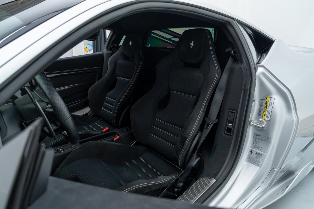 2015 Ferrari 458 Speciale interior with black Alcantara seats and white stitching.
