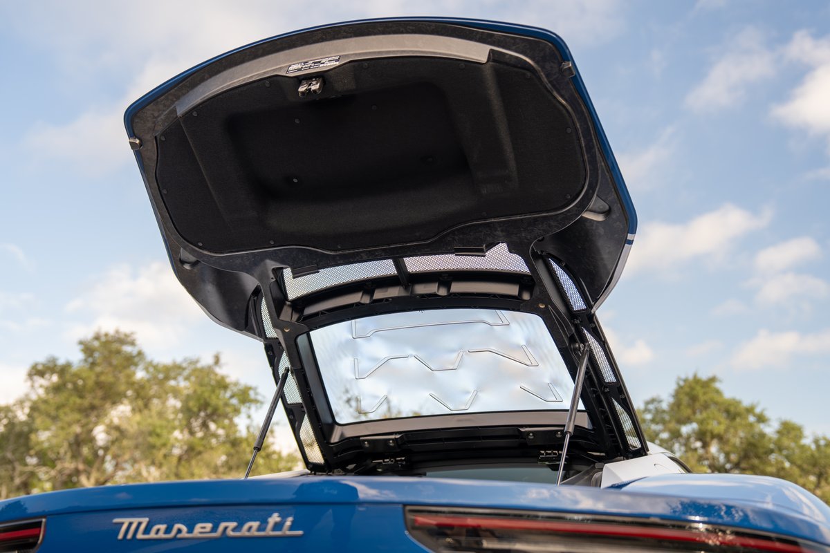 Open trunk of blue 2024 Maserati MC20 Icona.