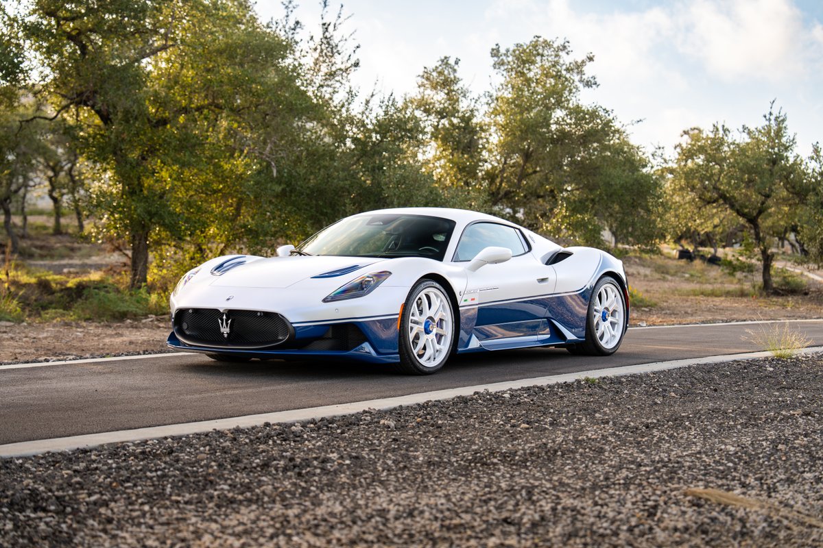 2024 Maserati MC20 Icona in white with blue trim and white rims.
