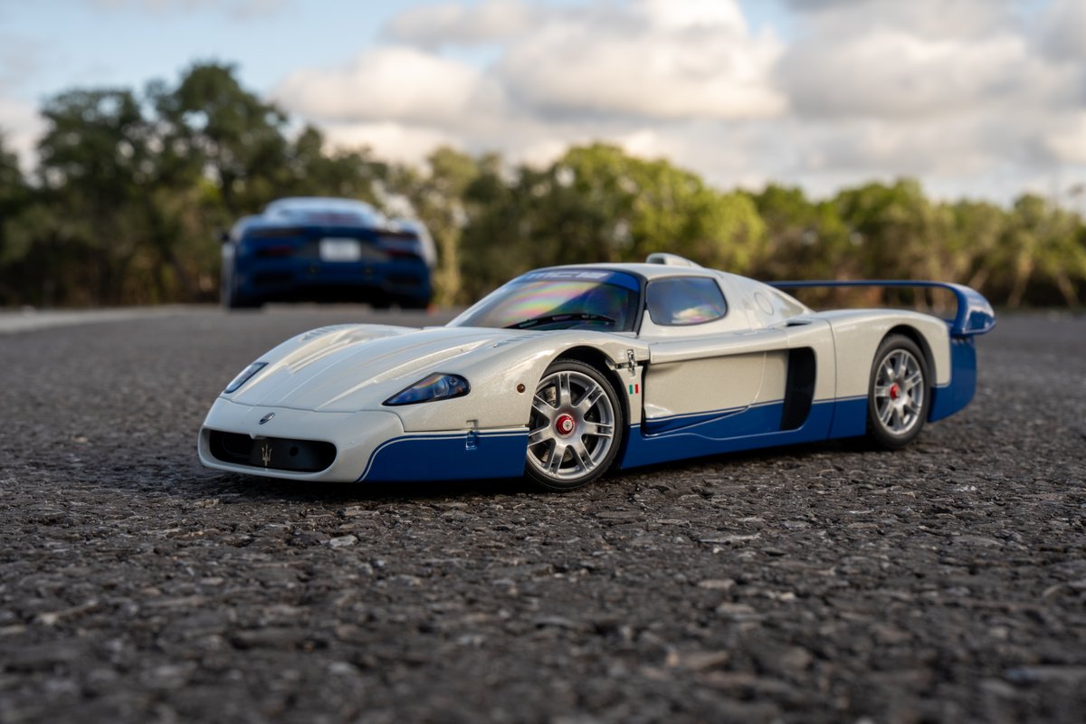 Maserati MC20 Icona: white & blue livery, performance rims, race car.