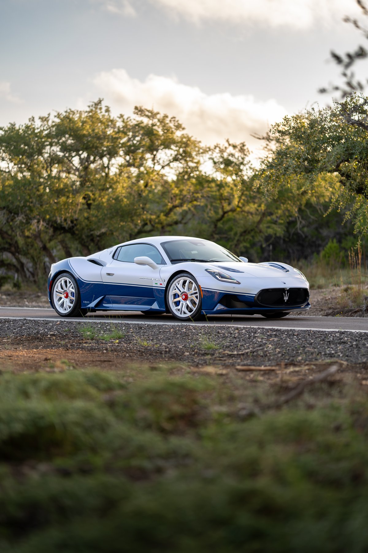 2024 Maserati MC20 Icona in white with blue trim and white rims.
