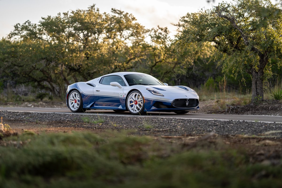 2024 Maserati MC20 Icona in white with blue livery, white rims, and blue trim.