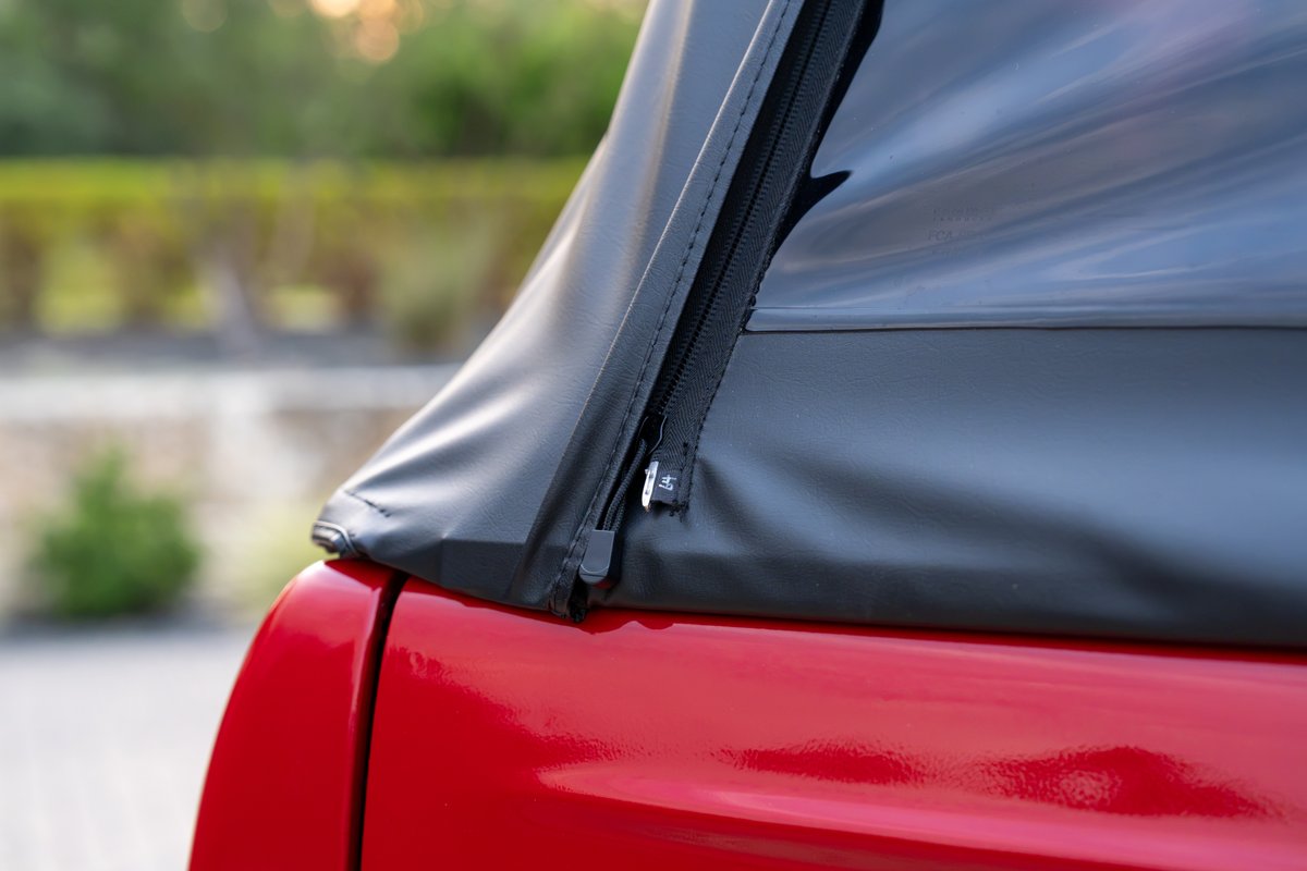1966 red Ford Bronco soft top zipper detail.