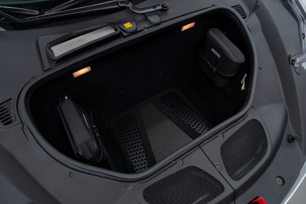 2015 Ferrari 458 Speciale frunk with Ferrari branded bag and floor mat.
