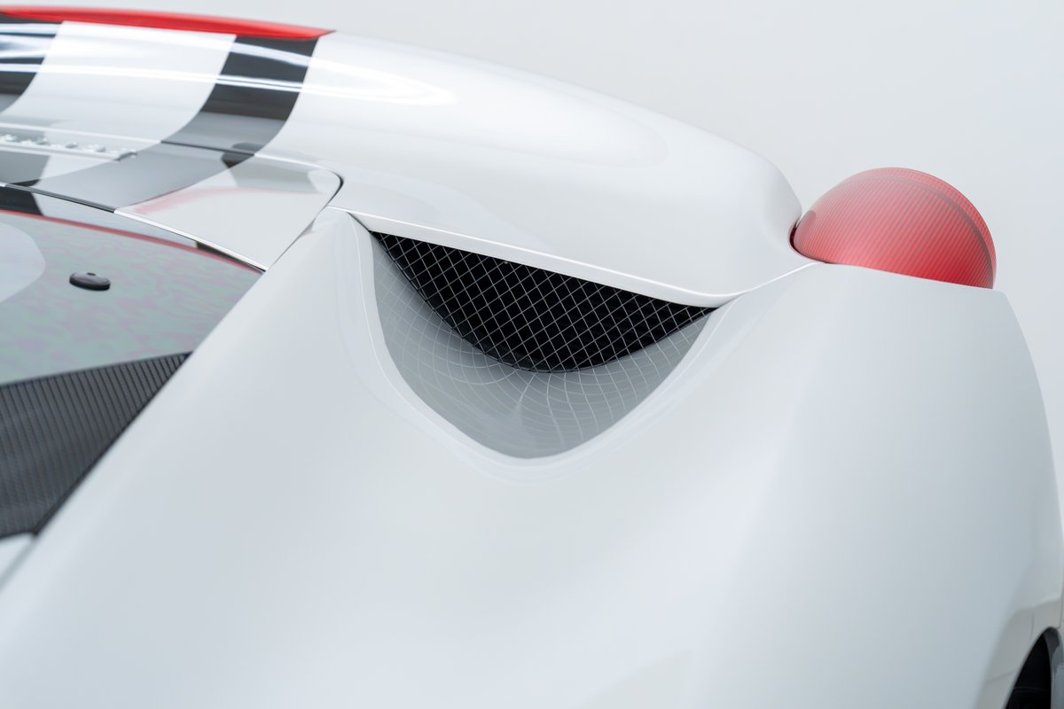 2015 Ferrari 458 Speciale in white with racing livery and red carbon fiber taillight.