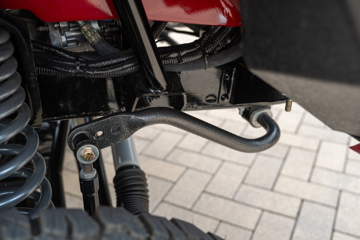 Close up of 1966 Ford Bronco's sway bar and suspension components.