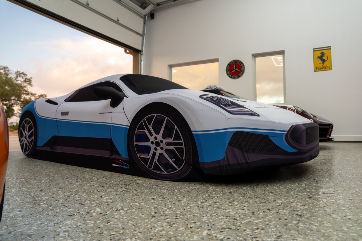 2024 Maserati MC20 Icona with white and blue livery, multi-spoke rims, and blue brake calipers.