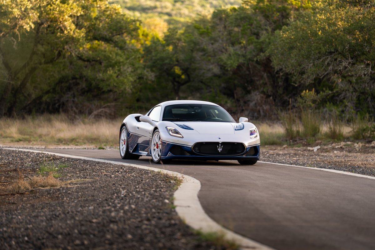 2024 Maserati MC20 Icona in white with blue trim and white rims.