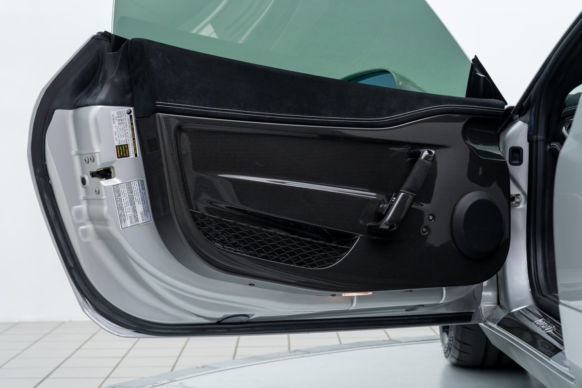 2015 Ferrari 458 Speciale door panel with carbon fiber trim and alcantara accents.