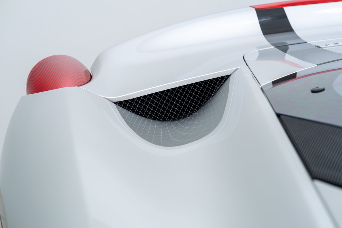 2015 Ferrari 458 Speciale rear fender with red taillight and carbon fiber trim.