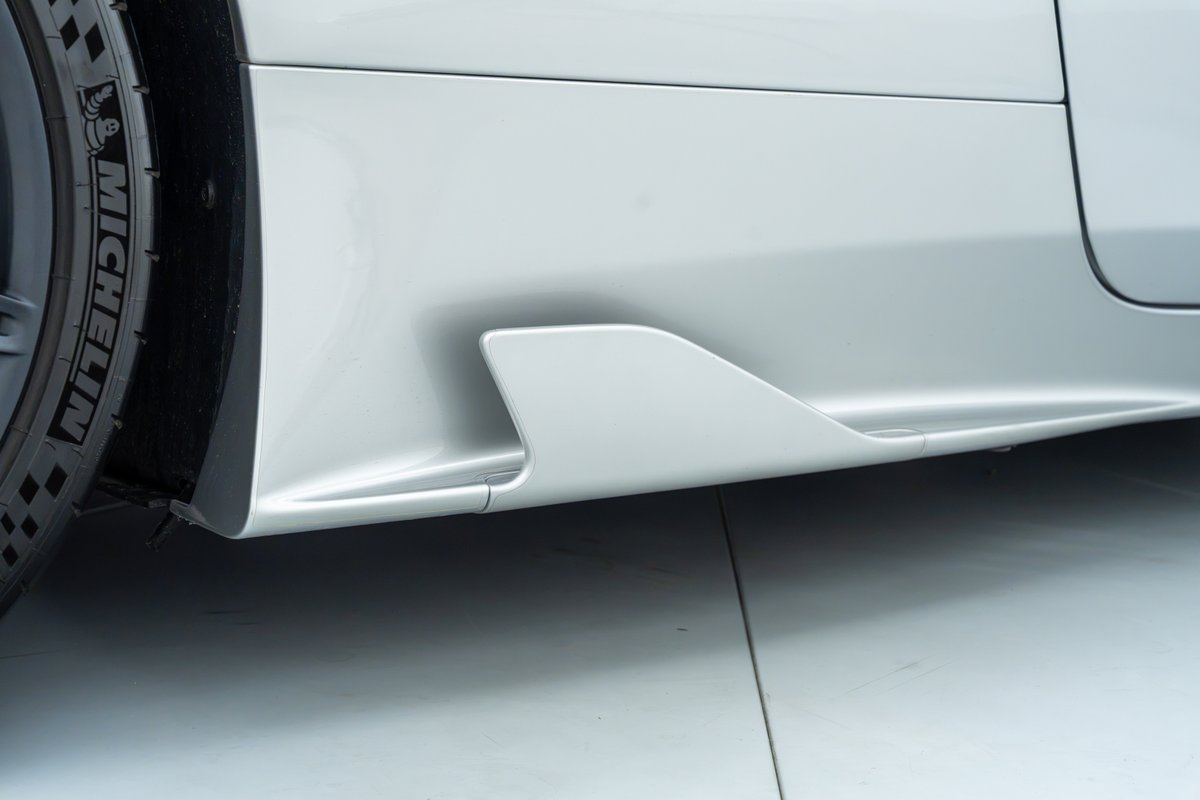 2015 Ferrari 458 Speciale silver side skirt with aero winglet detail.
