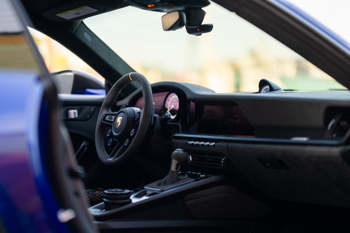 2025 Porsche 911 GT3 RS interior. Alcantara steering wheel, digital dash, and center console.