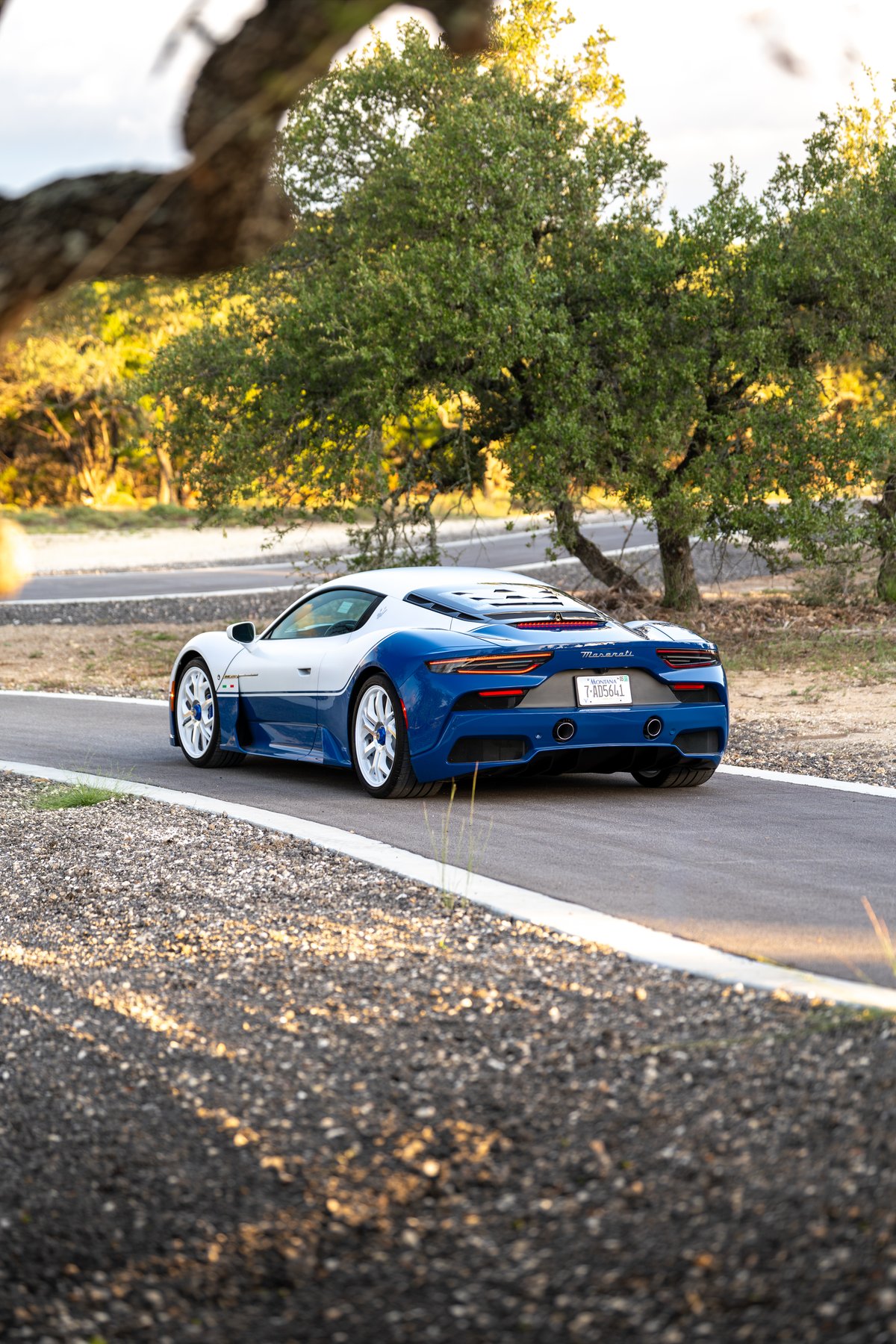 2024 Maserati MC20 Icona in blue and white two-tone livery, with white rims.