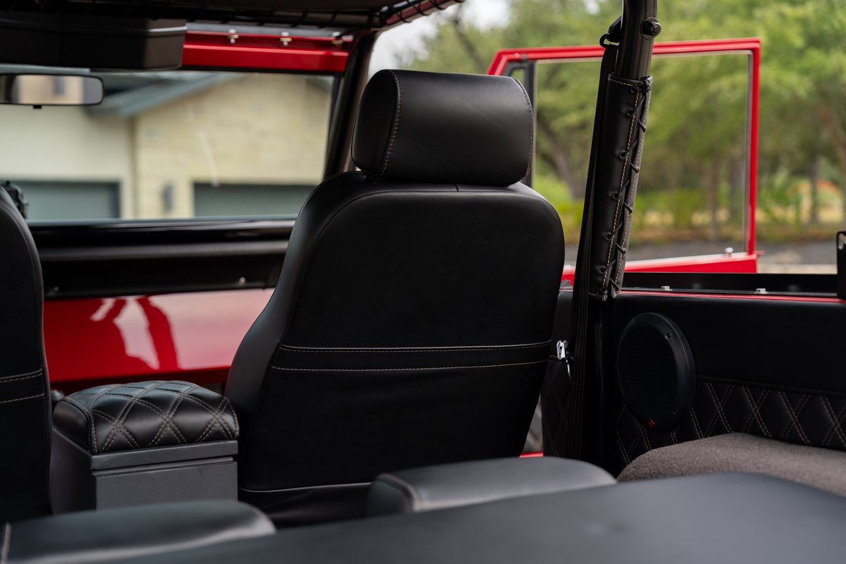 1966 Ford Bronco by Atlas Broncos. Black leather interior seats and diamond-stitched trim.