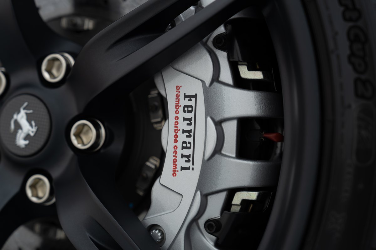 Close-up of a 2015 Ferrari 458 Speciale with carbon ceramic brakes.