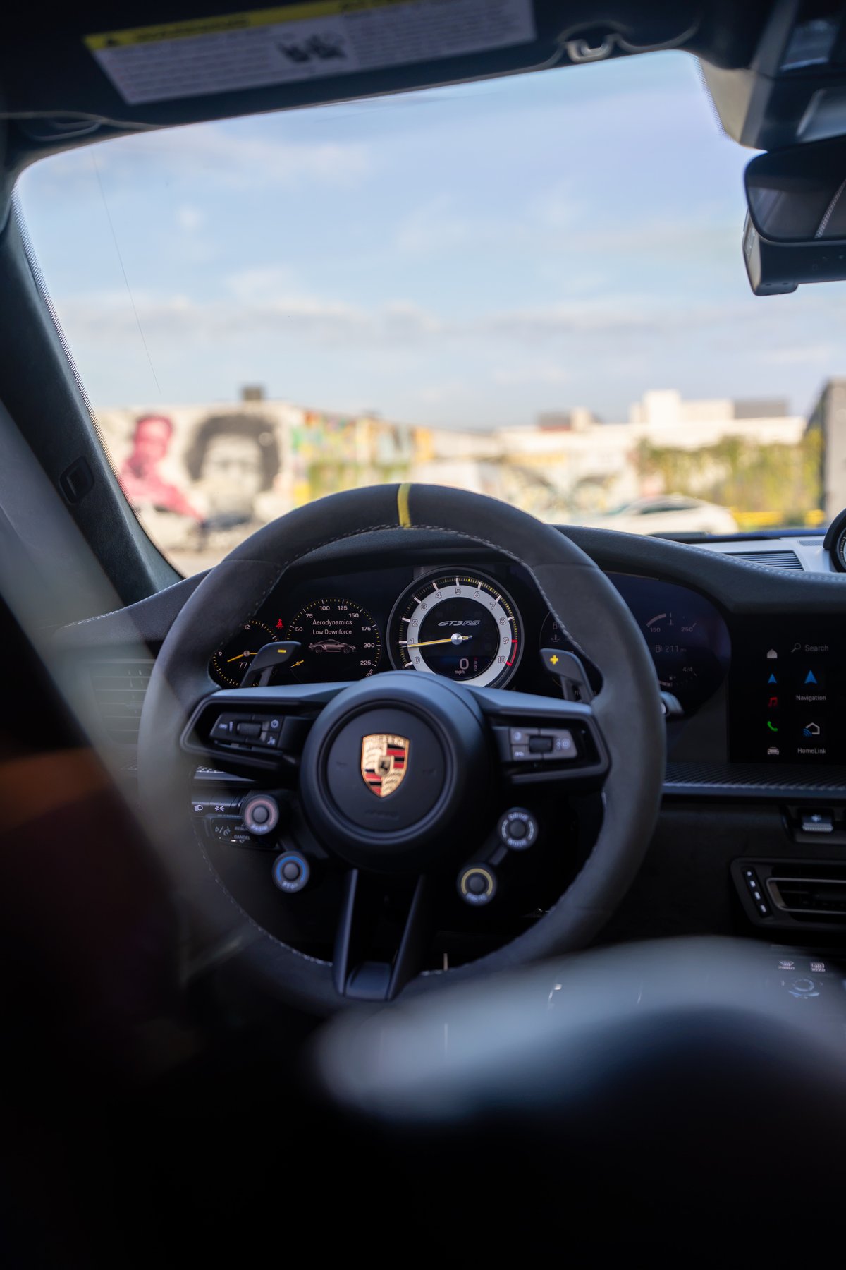 Interior view of a 2025 Porsche 911 GT3 RS steering wheel and dashboard.