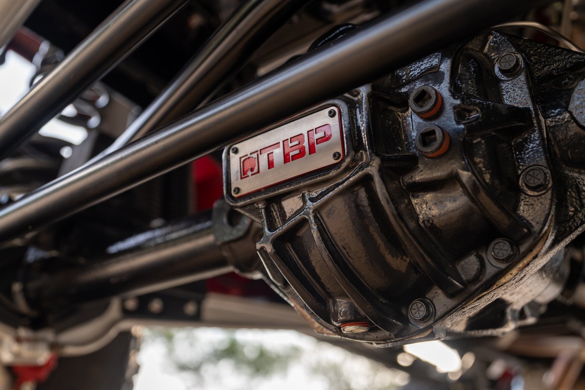 Close-up of a black differential with a red "GTBP" badge on a custom 1966 Ford Bronco.