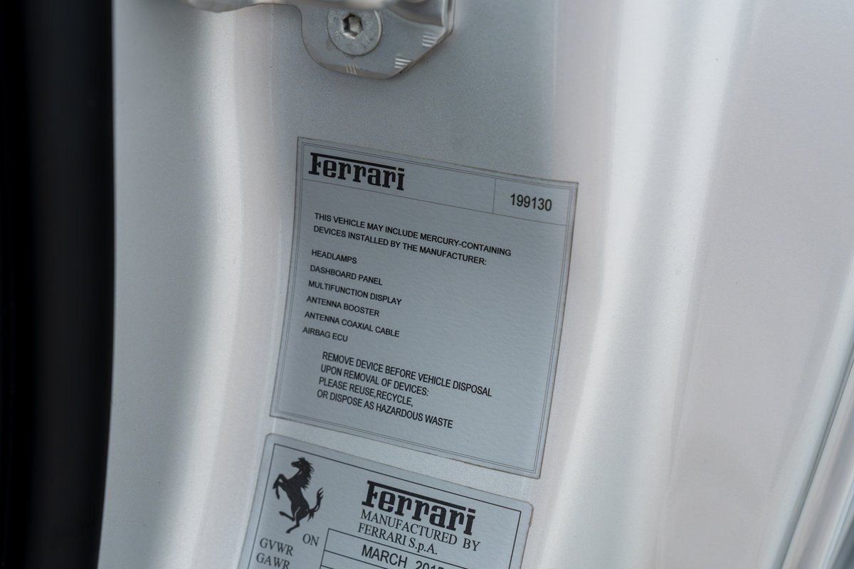 Closeup of Ferrari 458 Speciale doorjamb sticker.