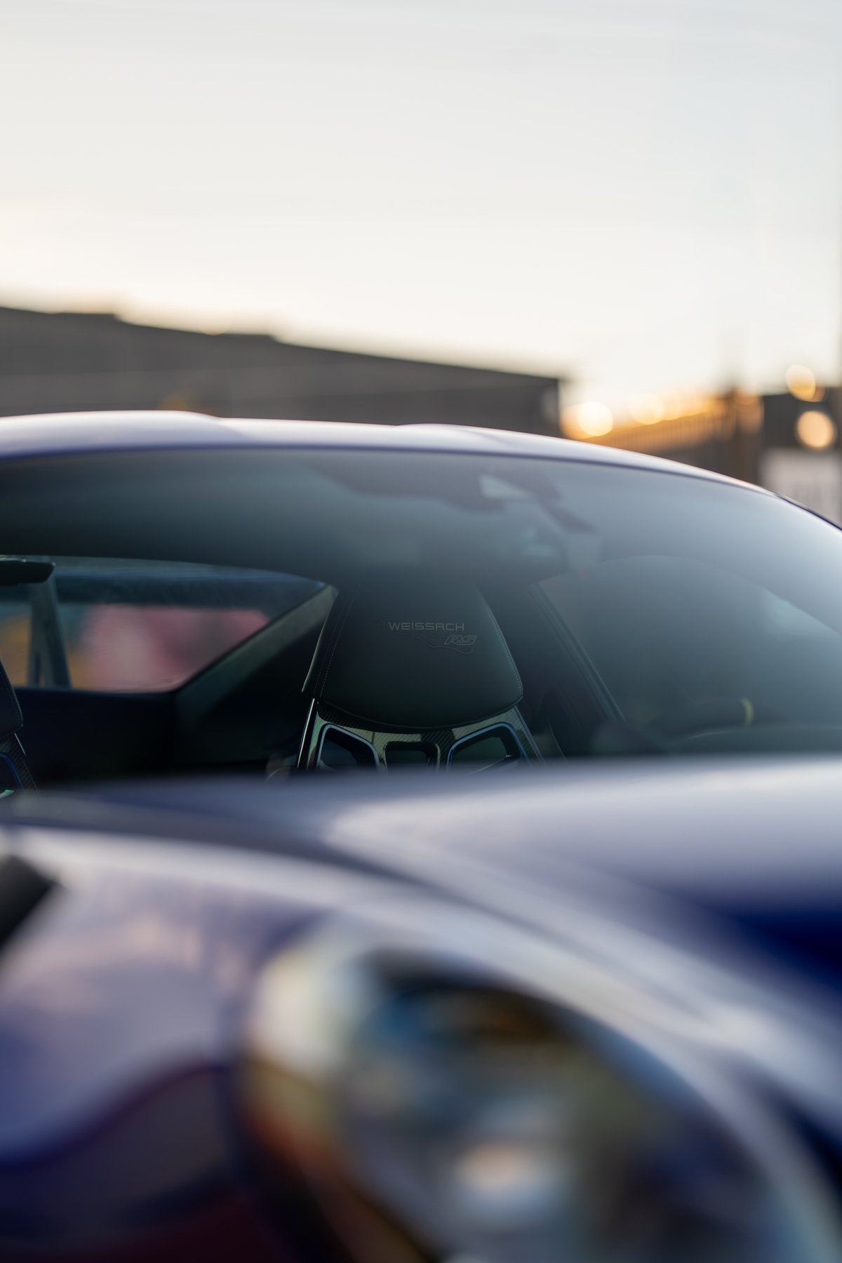 Close-up of the 2025 Porsche 911 GT3 RS Weissach package carbon-fiber racing seat.