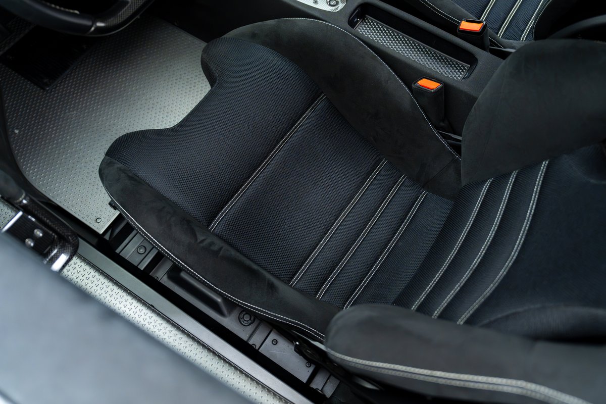 2015 Ferrari 458 Speciale interior with black Alcantara racing seats and white contrast stitching.