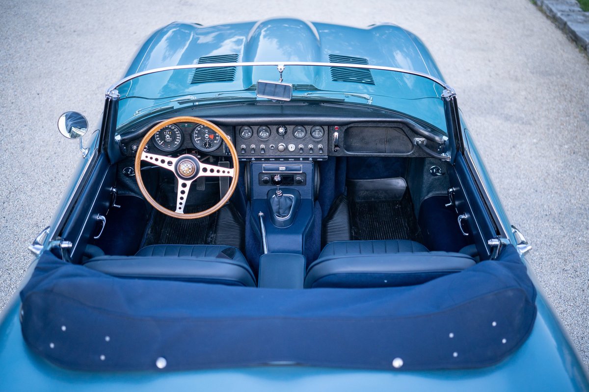 Overhead view of a 1966 Jaguar XKE convertible interior in opalescent silver-blue.