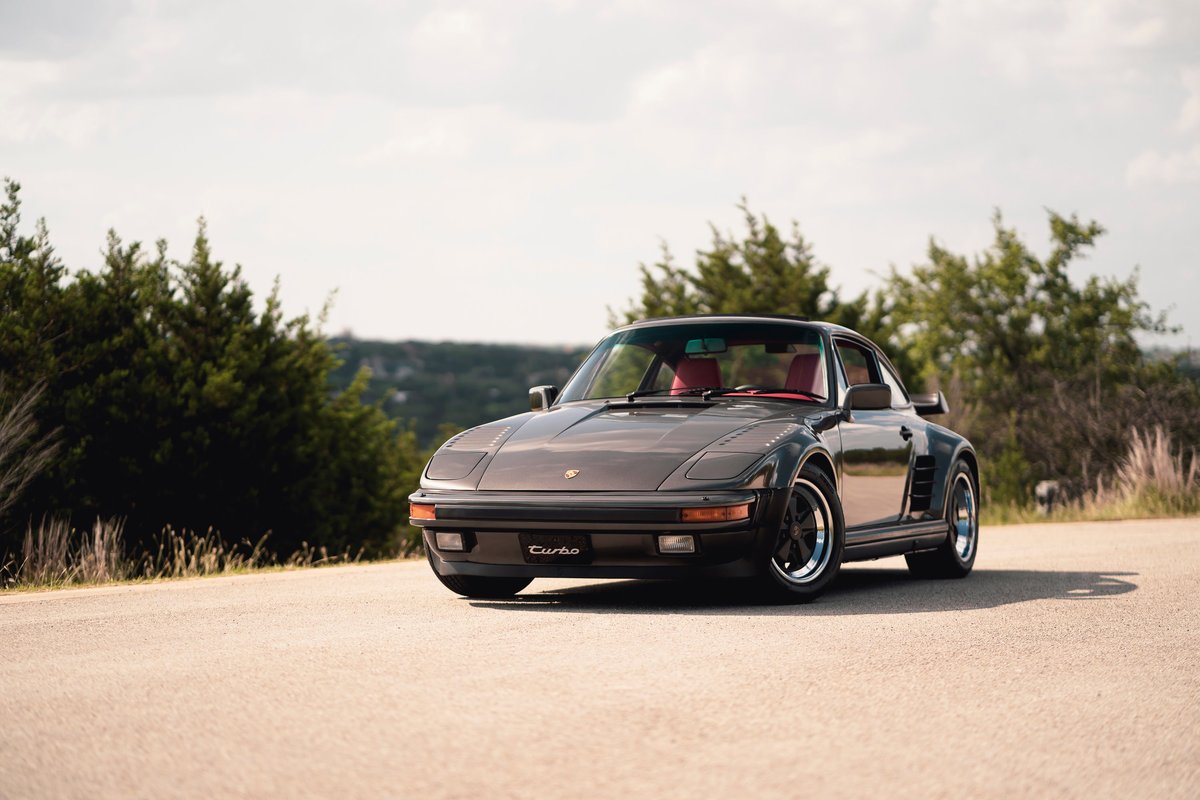 1989 Porsche 930 Turbo Flachbau in brown, with red interior, and Fuchs rims.