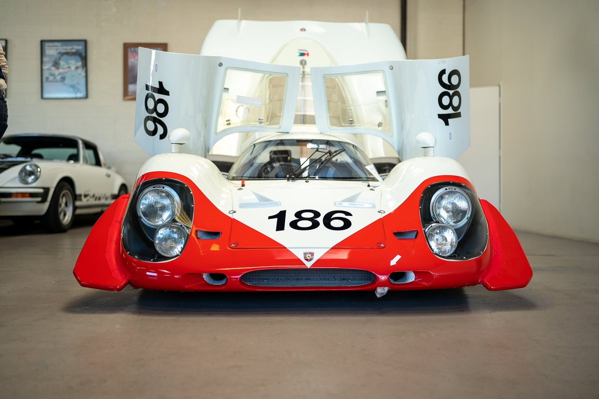 Front view of a white and red 1970 Porsche 917K with race livery "186".