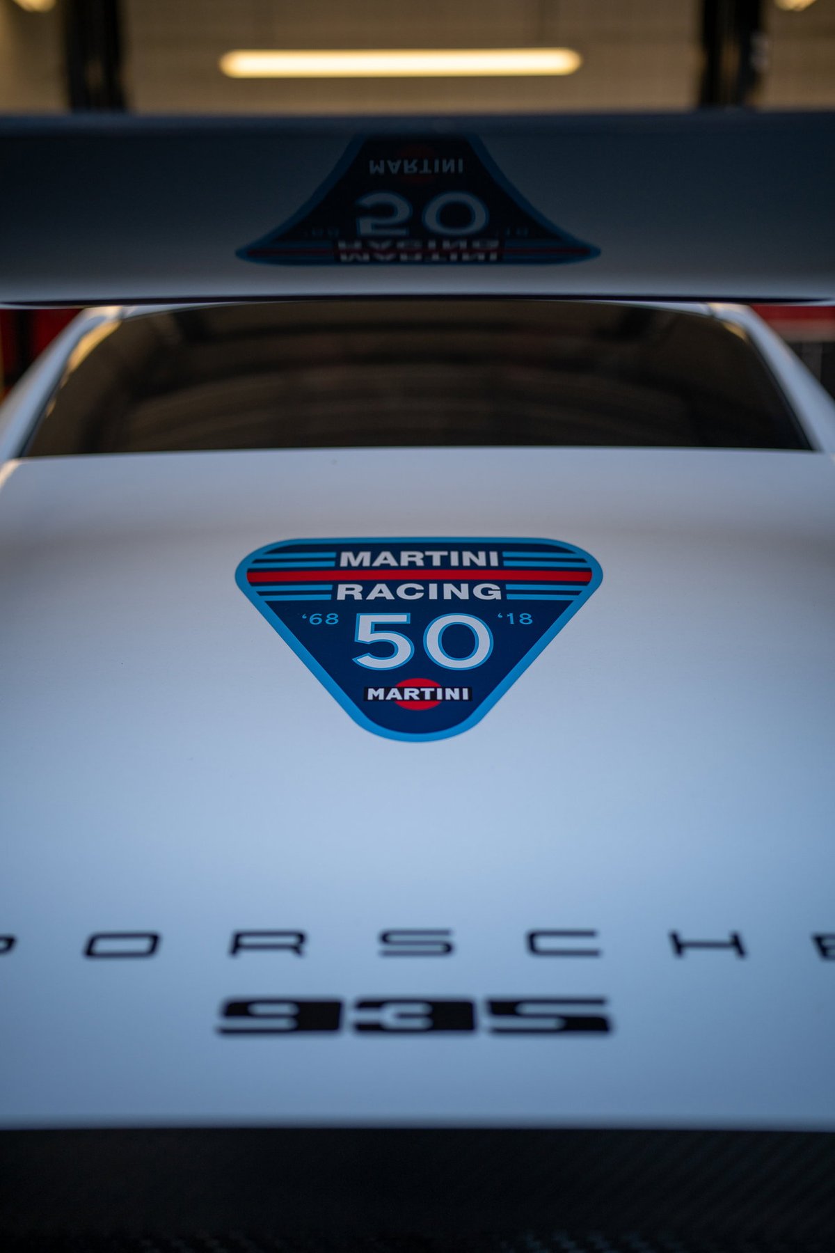 White Porsche 935 with Martini Racing 50th anniversary livery.