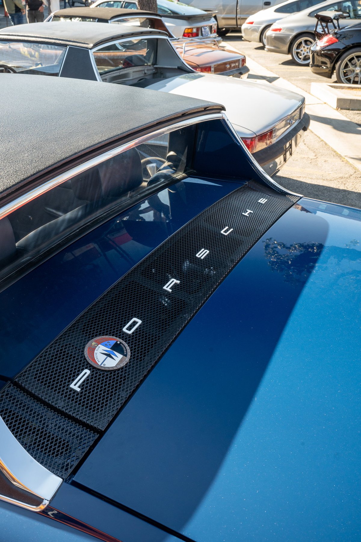 Blue Porsche 914 Targa with "PORSCHE" lettering on engine cover grate.