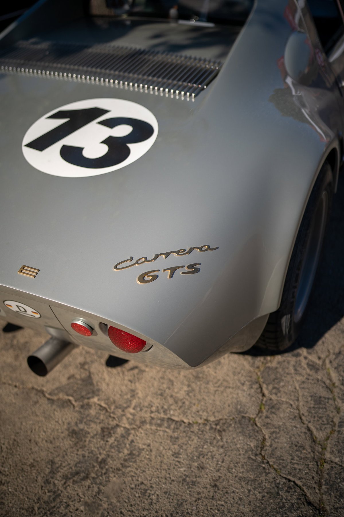 Silver Porsche 904 Carrera GTS with racing livery #13.