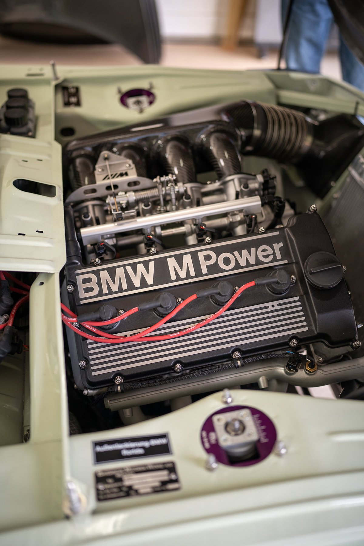 BMW M Power engine in a light green classic BMW at the Lit Show LA.
