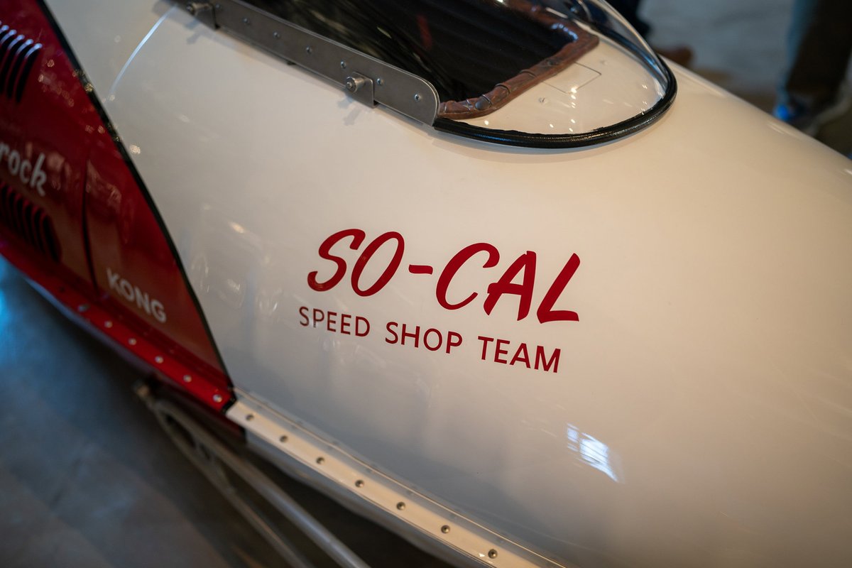 Close-up of a white & red So-Cal Speed Shop Team vintage race car's livery.