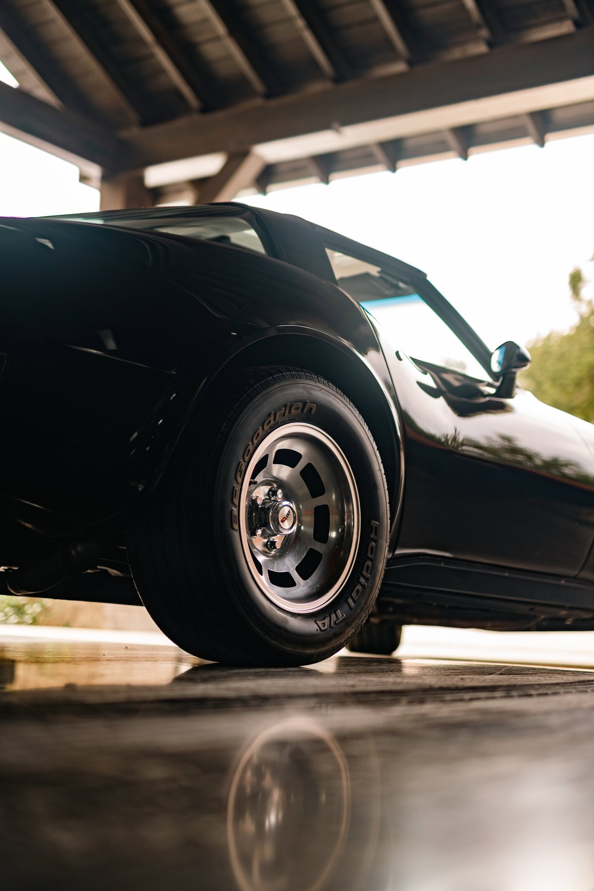 Black 1982 Corvette Stingray with classic turbine rims and BFGoodrich Radial T/A tires.