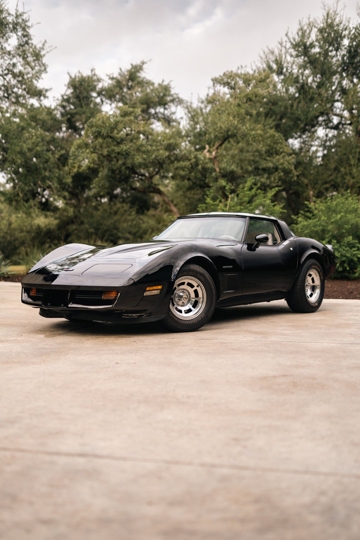Black 1982 Chevrolet Corvette Stingray with aluminum alloy rims.