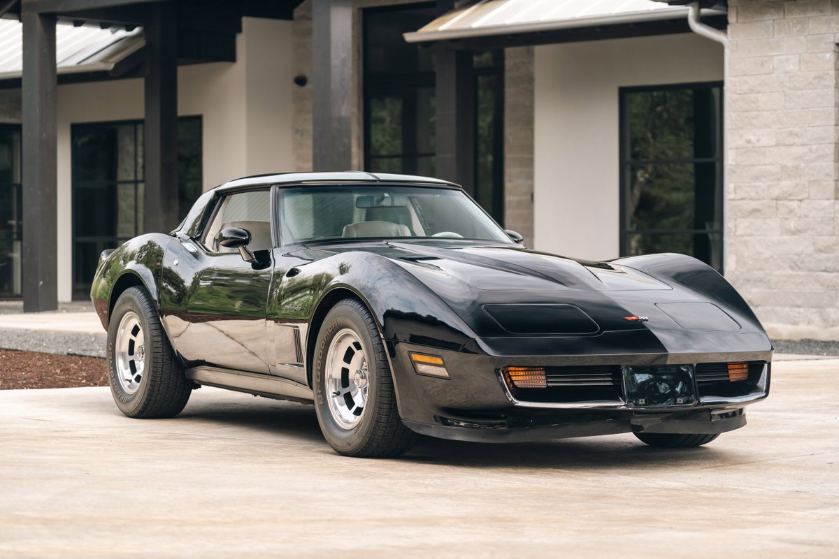 Black 1982 Chevrolet Corvette Stingray with chrome rims and a clean exterior.