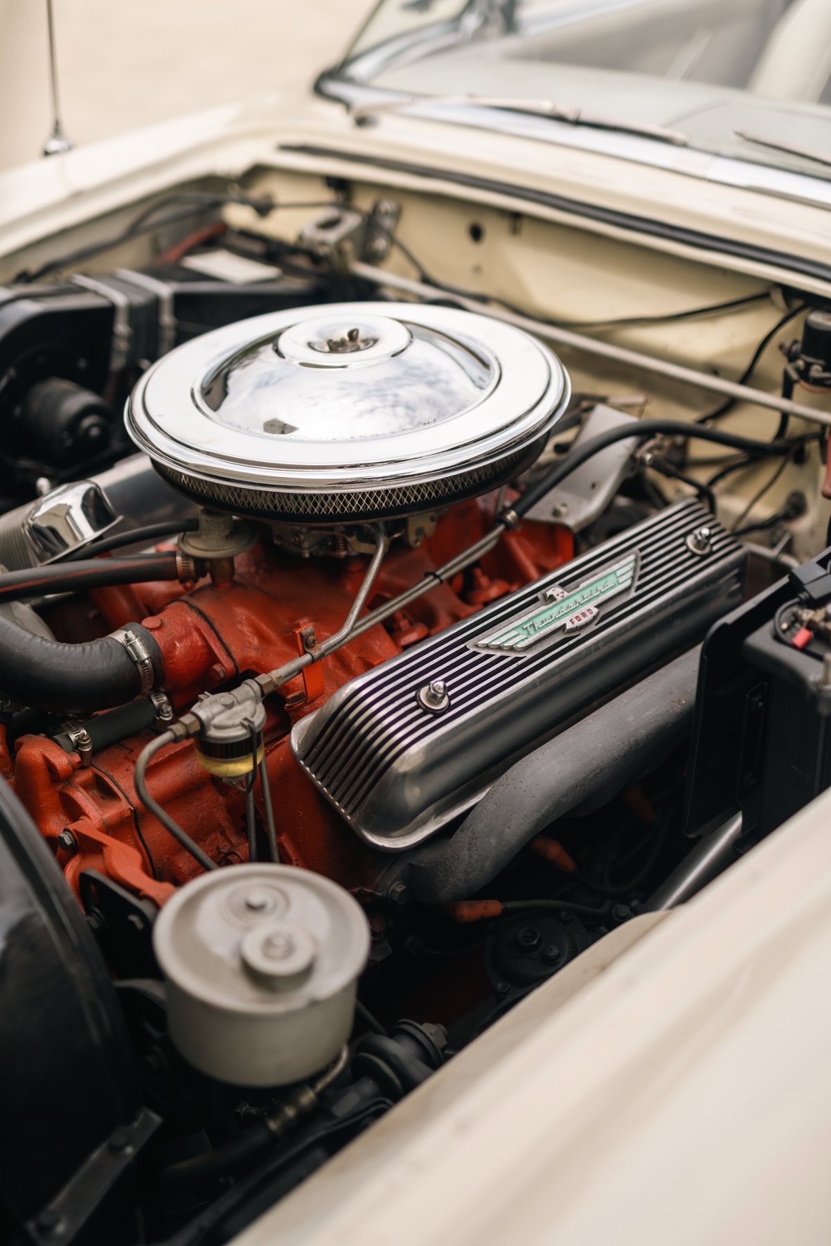 1957 Ford Thunderbird V8 engine with chrome air cleaner and ribbed valve covers.