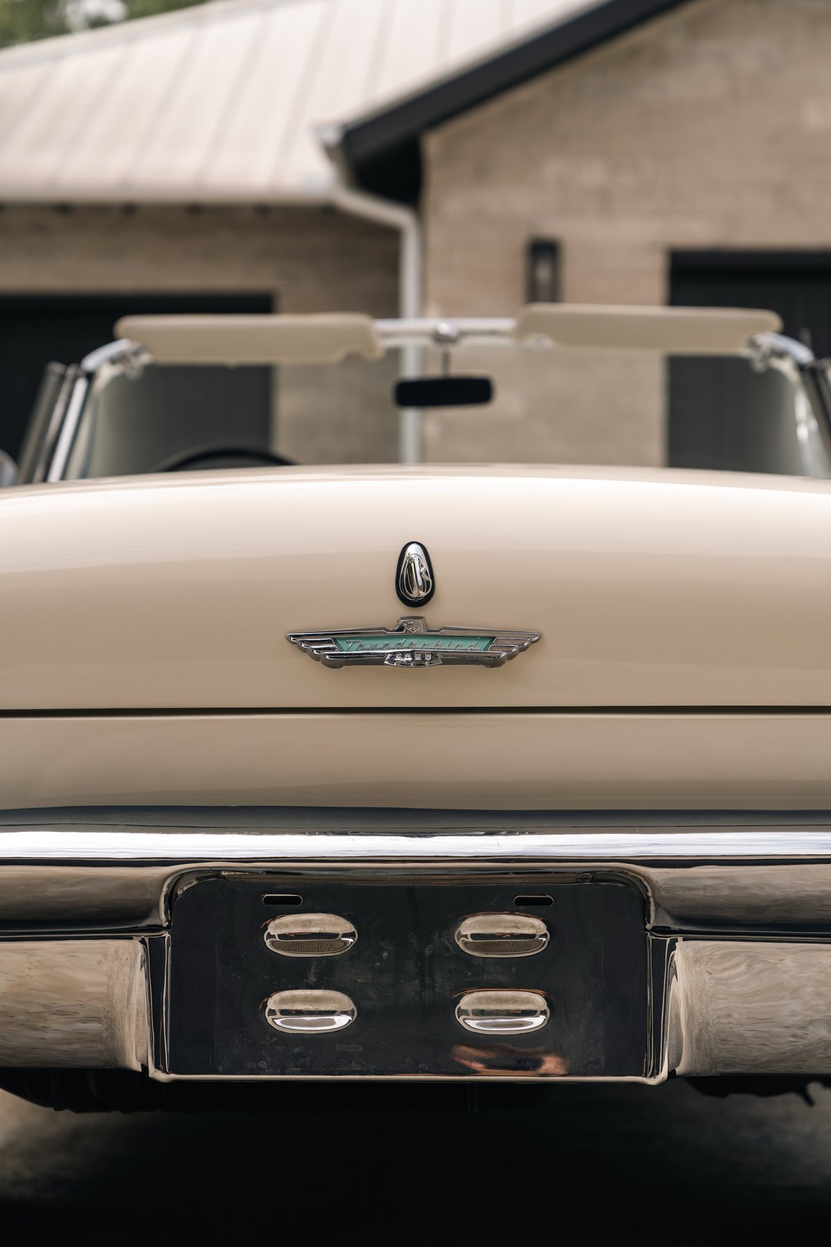 1957 Ford Thunderbird convertible in Colonial White, rear view. Chrome bumper and license plate holder.