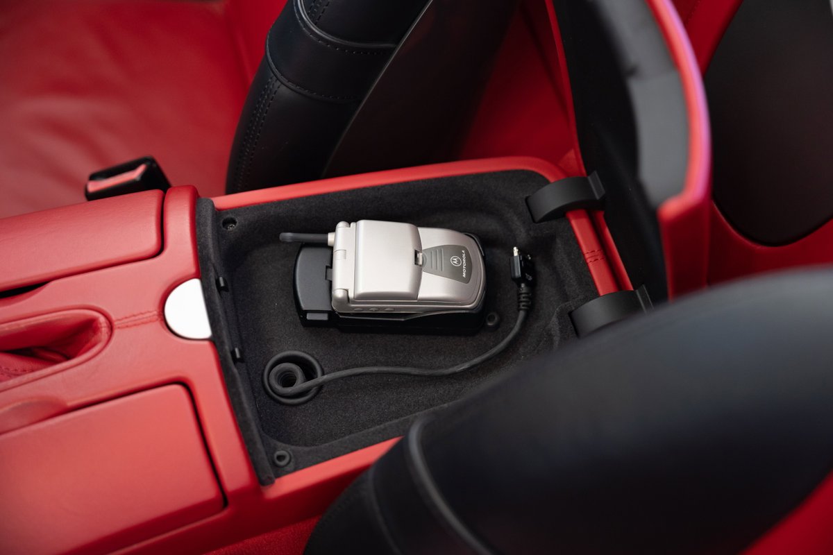 2002 BMW Z8 interior with integrated flip phone in the center console.