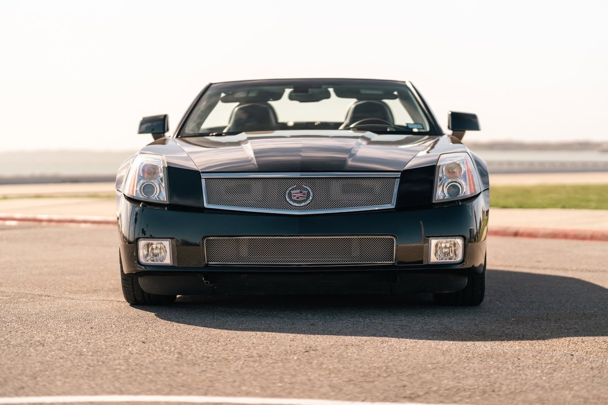 Front view of a black 2006 Cadillac XLR-V with chrome grille and accents.