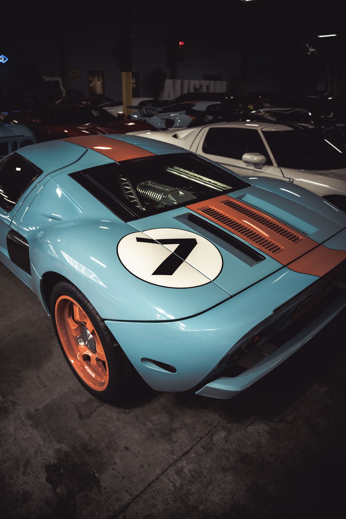 Ford GT40 with Gulf livery and orange rims, number 7 on the rear deck.