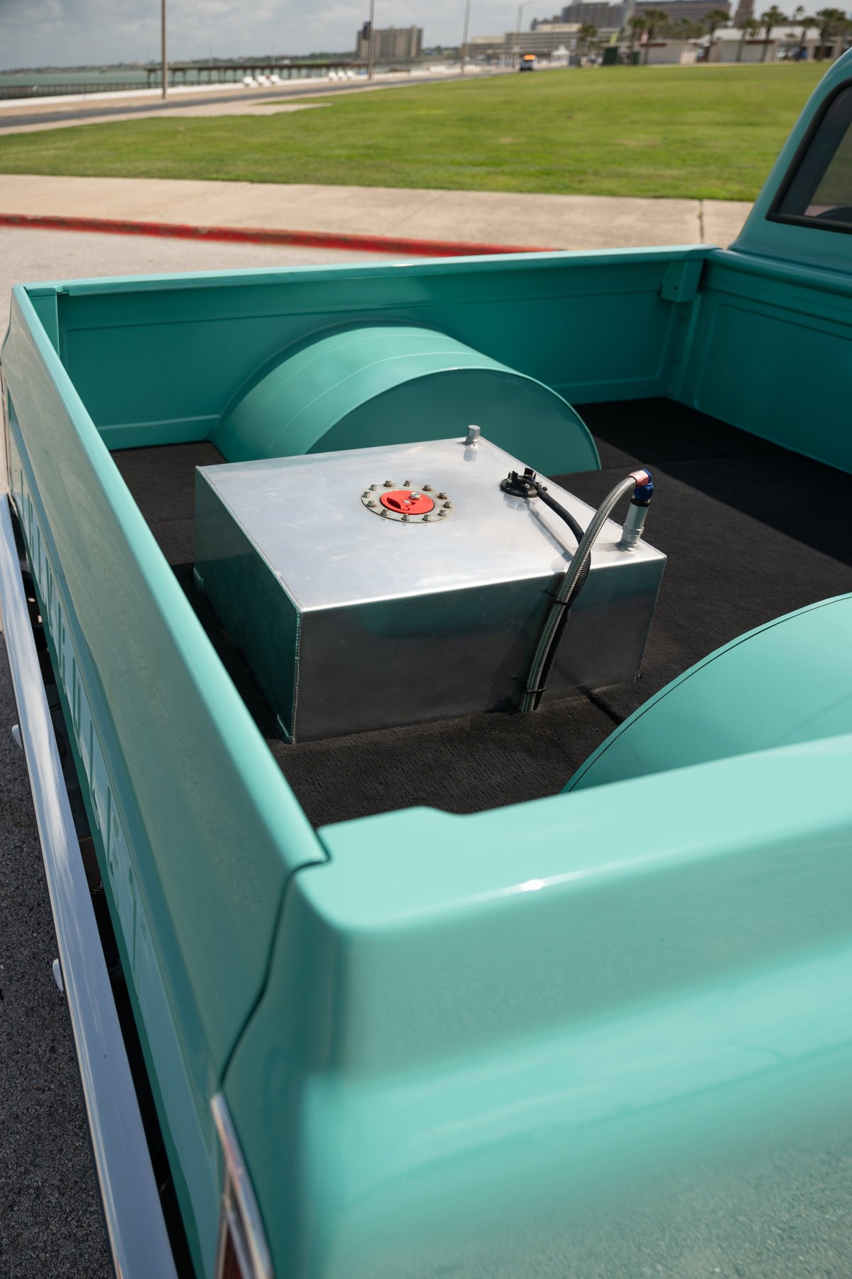 1968 Chevrolet C10 Pro-Street with custom fuel tank in bed and teal paint.